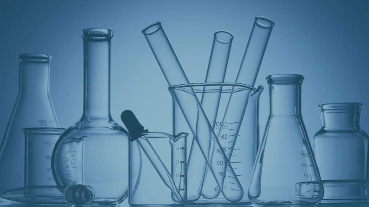 Close-up of laboratory bottles and tests for thyroid symptoms, emphasizing holistic thyroid care and understanding hidden patterns for wellness.